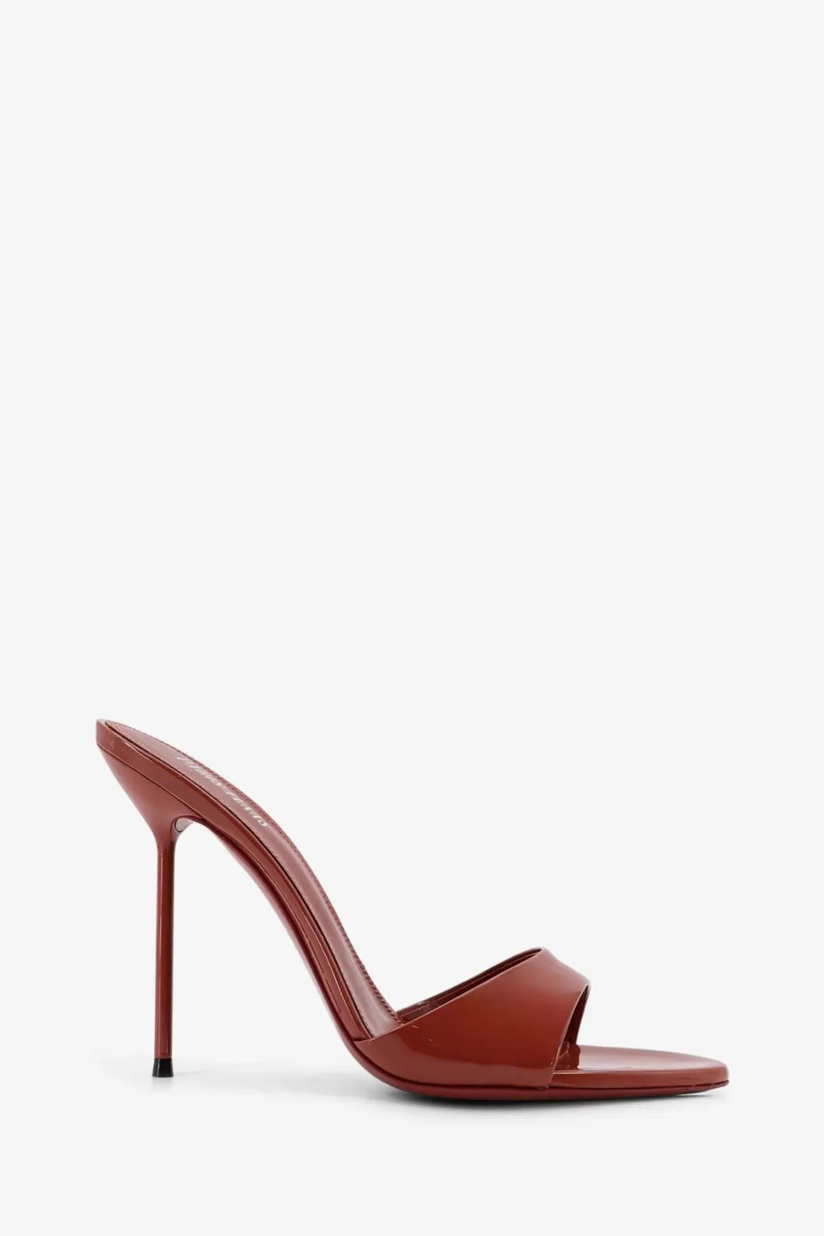 A sleek caramel-colored patent leather mule sandal with a slender high heel from Paris Texas women’s collection