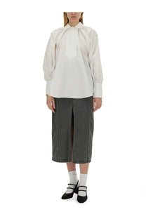 Patou women’s white cotton blouse with long sleeves, tie-front design, and subtle pleats at the neckline