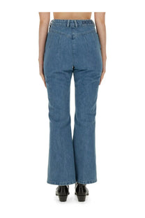 Blue denim high-waisted flare fit jeans with subtle pleated back design and patto embroidery on waistband back view