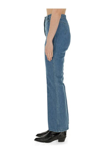 Patou women’s flare fit jeans in medium-wash blue denim with a high waist and classic stitching detail