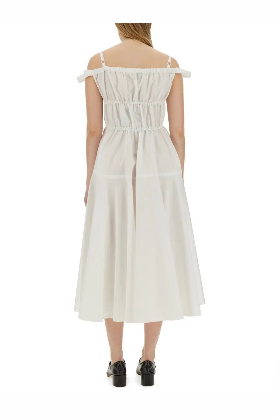 Patou women’s long dress in white features an off-the-shoulder midi design with gathered bodice and thin straps