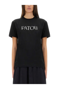 Black Patou women shirt featuring white Patou lettering across the chest in a casual cotton t-shirt design