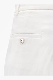 White button with a smiling face design and metallic finish on pinko womens byrana linen and viscose shorts white