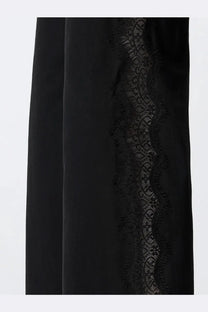 Pinko women’s black velvet skirt with delicate black lace trim down the side styled as denim trousers