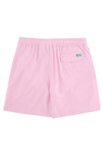 Back view of polo ralph lauren men’s pink swim trunks with elastic waistband and single buttoned pocket