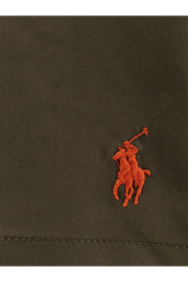 Orange embroidered polo player logo on dark olive fabric of polo ralph lauren men’s nylon swimtrunk green