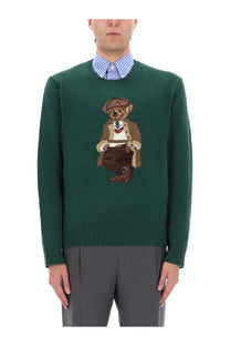 Dark green knit sweater by polo ralph lauren featuring an embroidered teddy bear in a vintage suit and hat