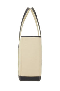 Cream-colored canvas tote bag with black leather trim and handles from Polo Ralph Lauren women’s Borsa Shopper medium pink