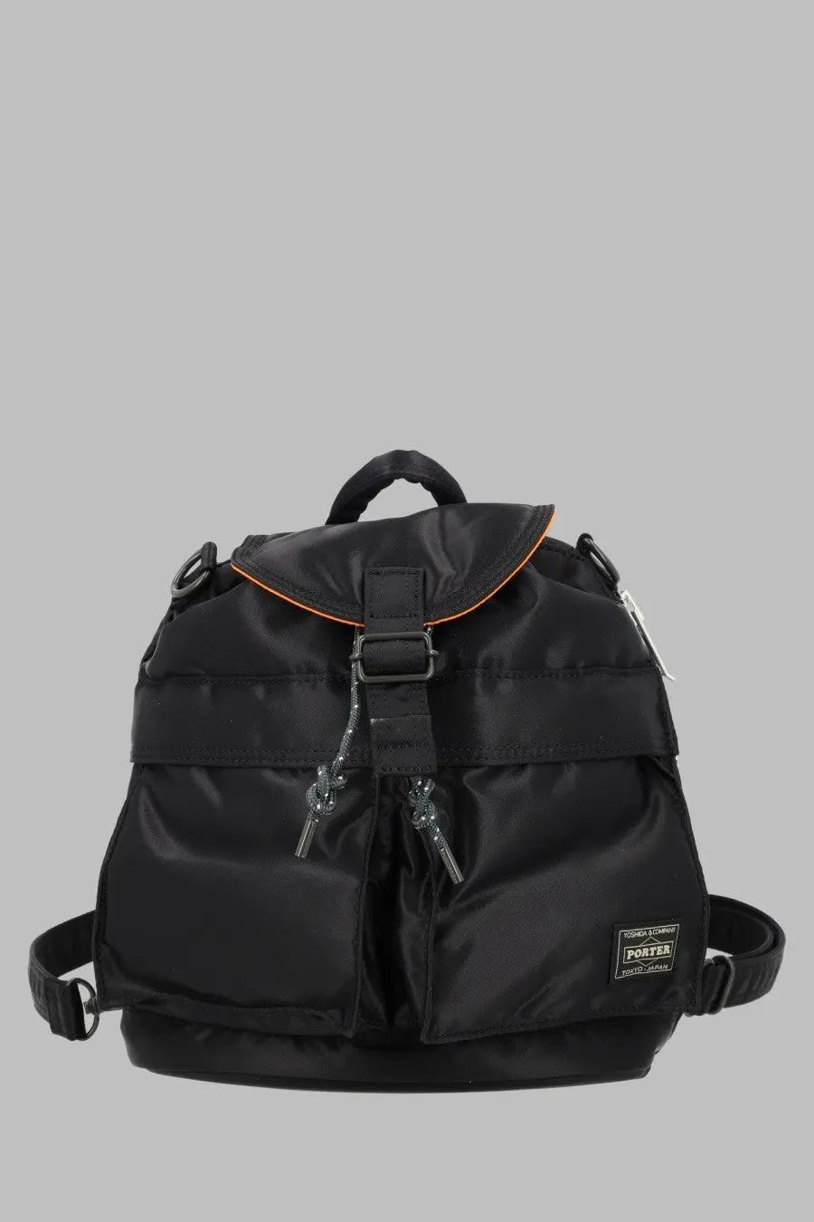 Porter Yoshida &amp; Co men’s zaino tanker backpack in black nylon with orange-trimmed flap and durable construction
