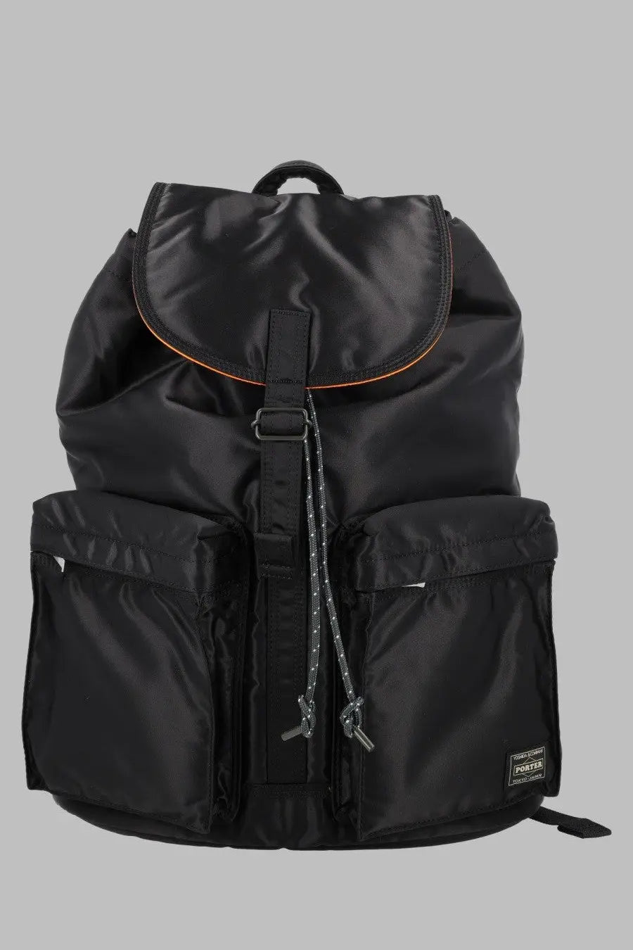 Porter-yoshida &amp; co men’s zaino tanker black nylon backpack with orange trim and small brand patch on lower right side