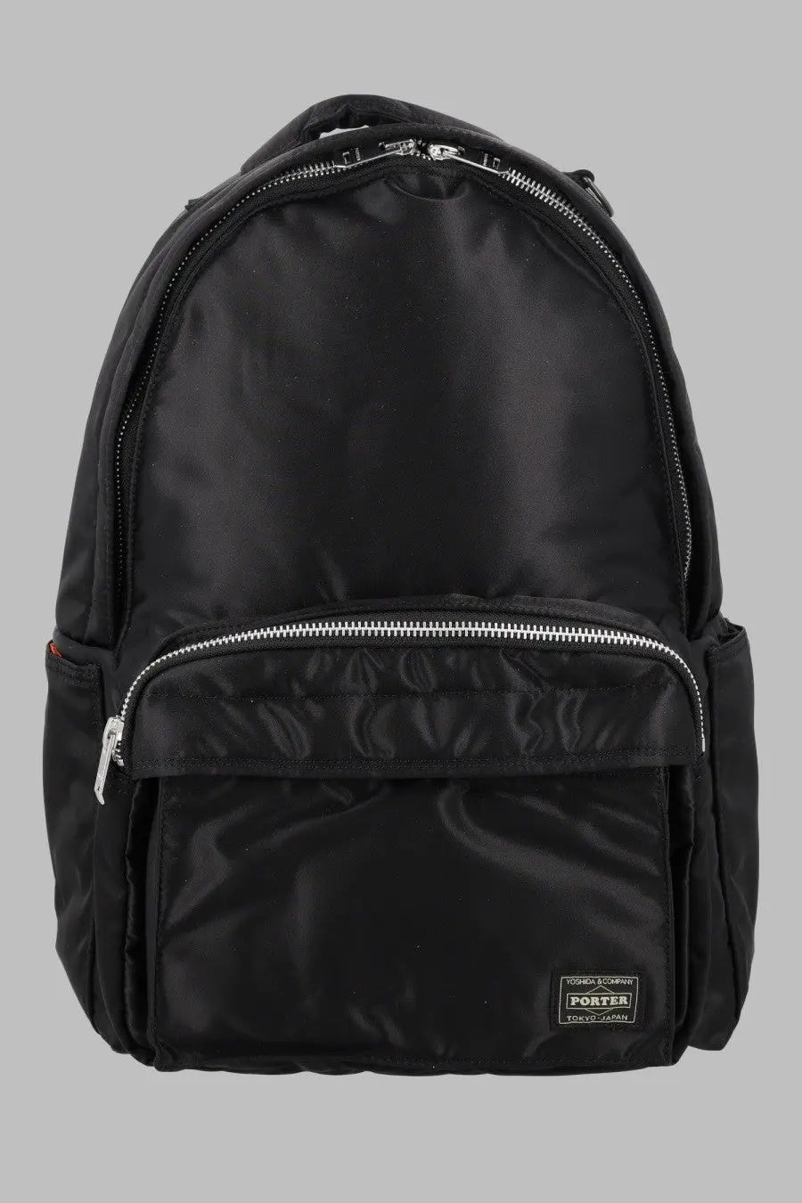 Porter yoshida &amp; co men’s zaino tanker black black nylon backpack with silver zippers and small brand patch front view