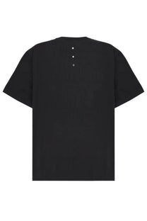 Back view of premiata men’s black oversized shirt with three silver buttons down the center of the back