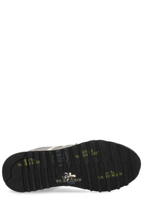 Back of premiata men’s sneaker lucy grey with black rubber sole yellow text and silver logo on the heel