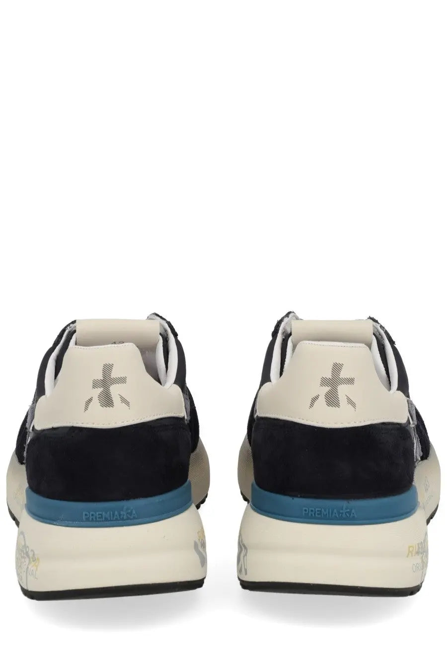 Back view of premiata men’s sneaker mick blue in black and cream suede with bold blue midsole and premiata logo on heel