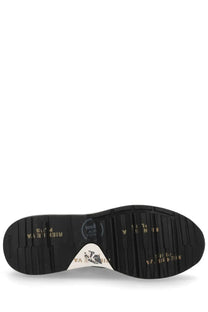 Black rubber sole with gold lettering and white triangular logo patch on the back of premiata men’s sneaker mick grey