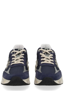 Premiata men’s sneaker moerun blue in navy blue and gray suede with cream laces and chunky white sole visible from back side
