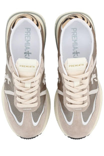Premiata women’s cassie sneaker multicolor in beige and gray with tiger print heel lining white laces and white stripes