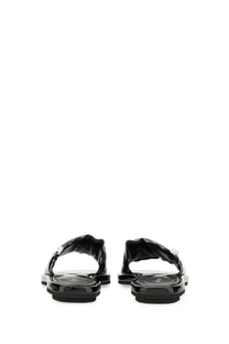 Premiata women’s slide sandal black glossy rubber flip flops with twisted strap design and white accent details