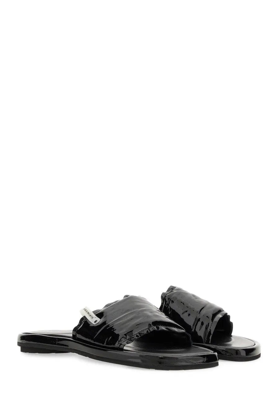 Premiata women’s slide sandal in black patent leather with a sleek minimalist design and small brand tag on the strap