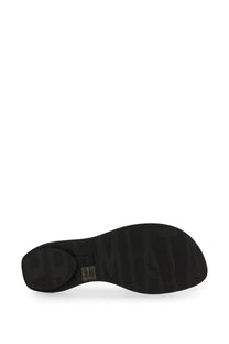 Back view of premieta women’s white slide sandal with black rubber sole and embossed upmate branding near heel