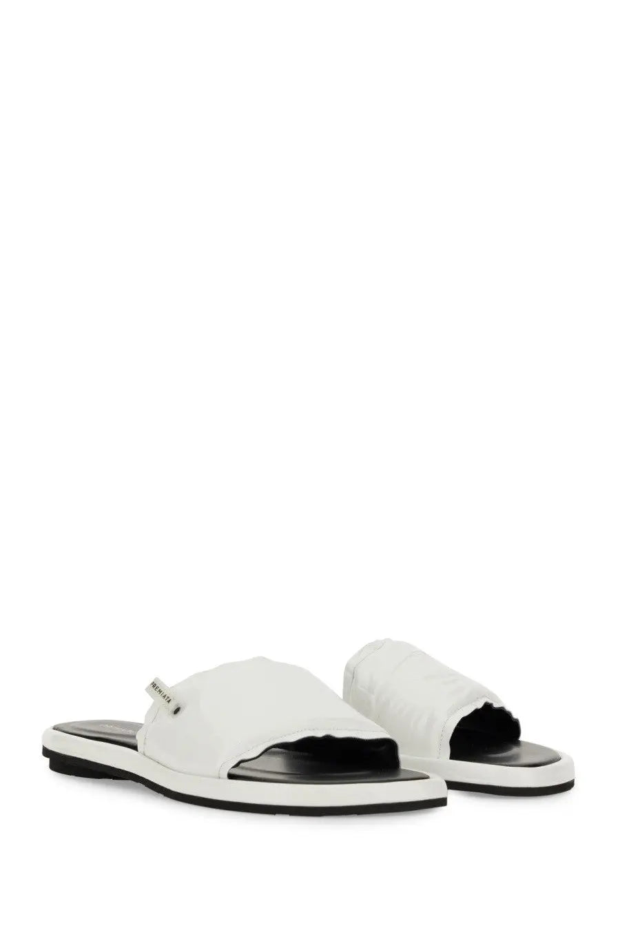 Premiata women’s white canvas slide sandal with black rubber sole and brand tag on the strap