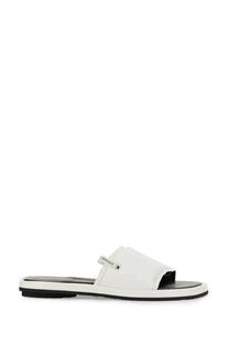 Premiata women’s slide sandal in white patent leather with black rubber sole and small silver logo tag