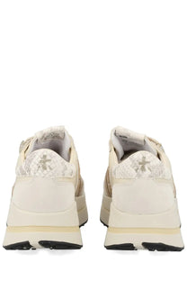 Premiata women’s cream-colored sneaker bethcoin white with snakeskin heel tab metallic star logo and chunky sole design