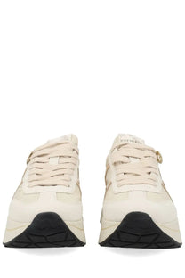 Premiata women’s sneaker bethcoin white in cream suede and mesh with black soles and gold-tone metal eyelet accent