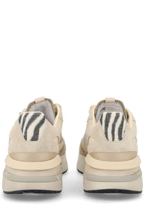 Back side of premiata women’s sneaker moerund beige cream suede with black and white zebra patch on heel