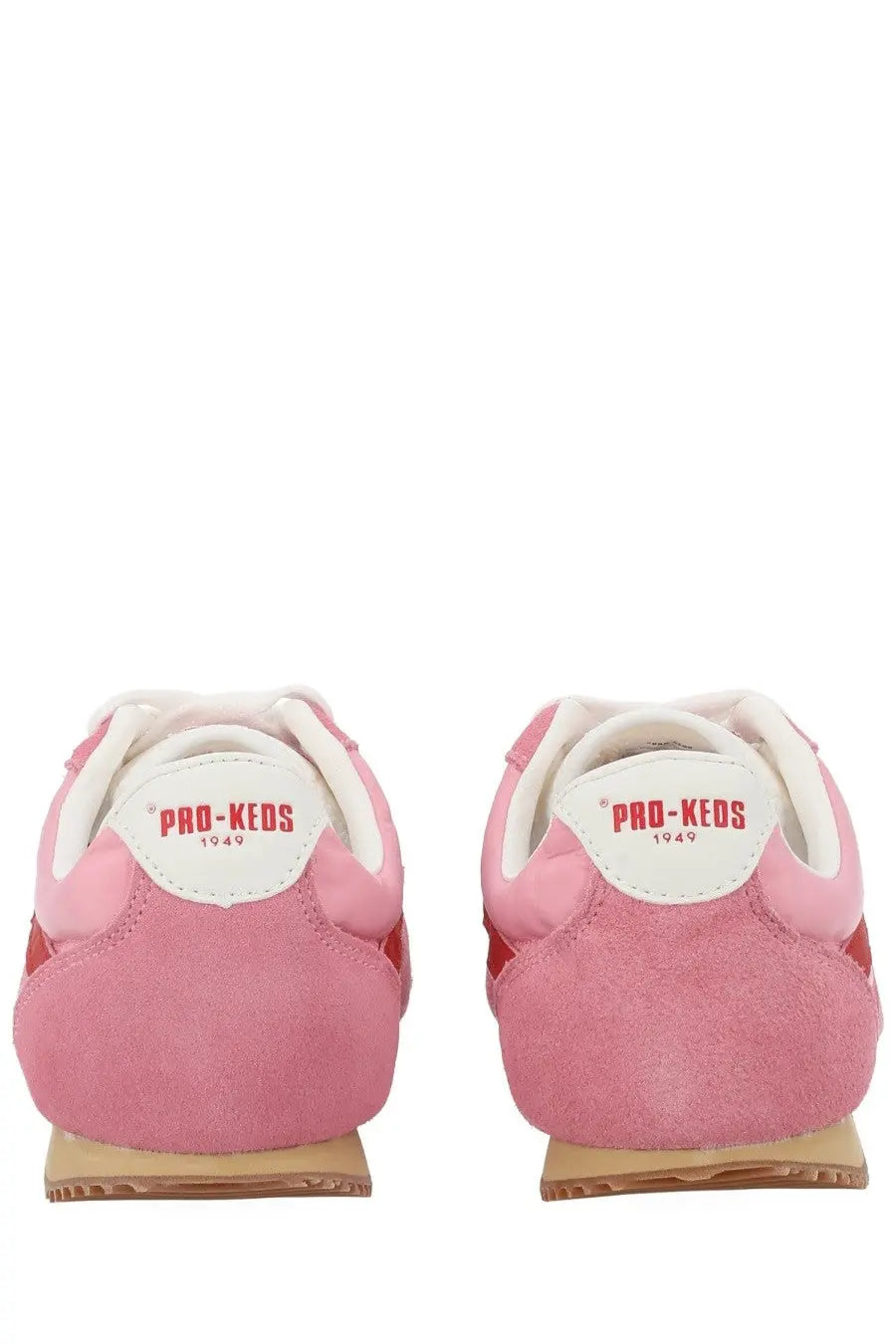 Pink suede pro-keds 1949 sneakers with white accents and tan rubber sole from pro-keds women’s reacer sneaker blue line