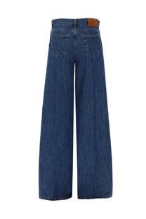 Pt torino women’s jeans cindy blue wide-leg blue denim trousers with brown leather brand patch at waistband back view
