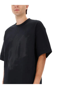 Black oversized crewneck t-shirt from purple brand dust black with subtle abstract graphic print on front