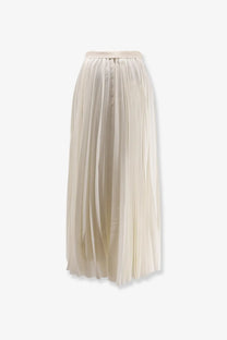 A flowing cream-colored pleated midi skirt made of lightweight fabric from R2W women’s Aristo pleated skirt white collection