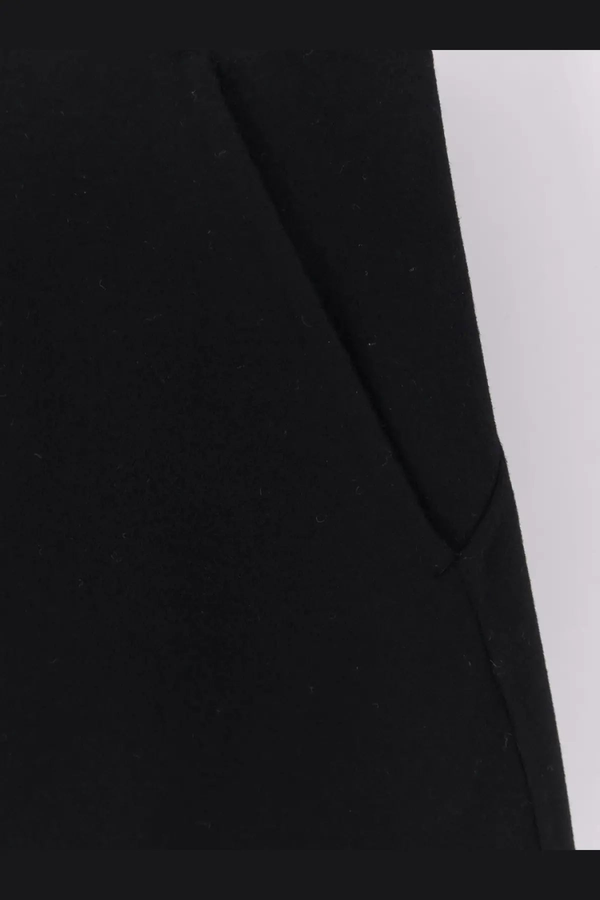 Black wool blazer with structured shoulder and clean seam detailing paired with r2w women’s catran midi wool and cashmere skirt black