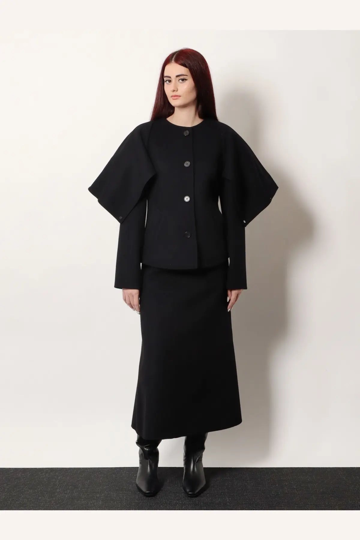 Black cape-style coat with wide structured sleeves and button-front design in wool and cashmere blend