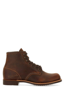 Brown leather work boot with visible stitching and sturdy sole from red wing mens stivale blacksmith brown