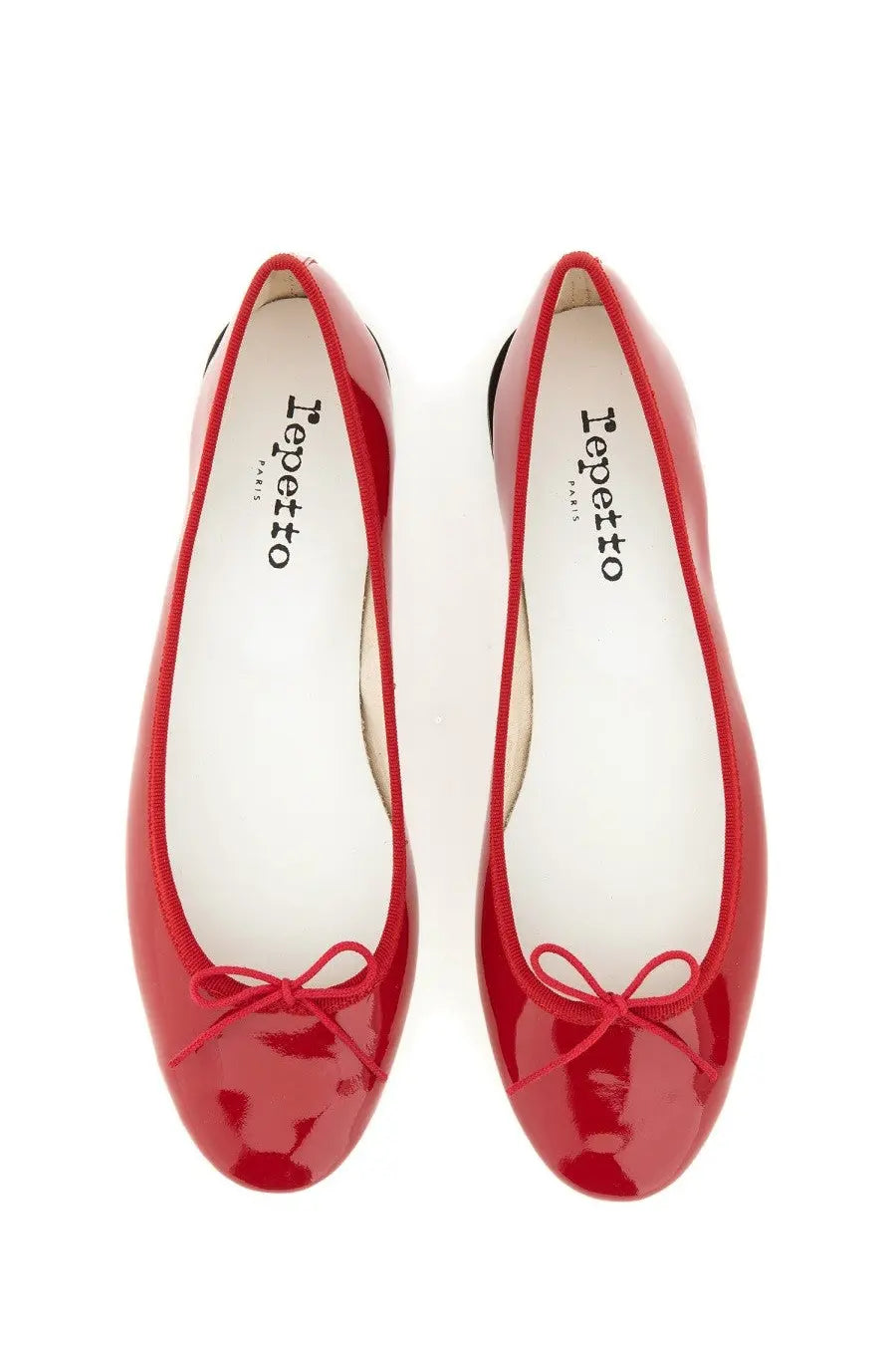 Red patent leather ballet flats with small bow at the toe from Repetto women’s ballerina Cendrillon collection