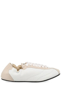 Repetto women’s sneaker tennis multicolor with minimalist white upper beige accents and sleek black rubber sole