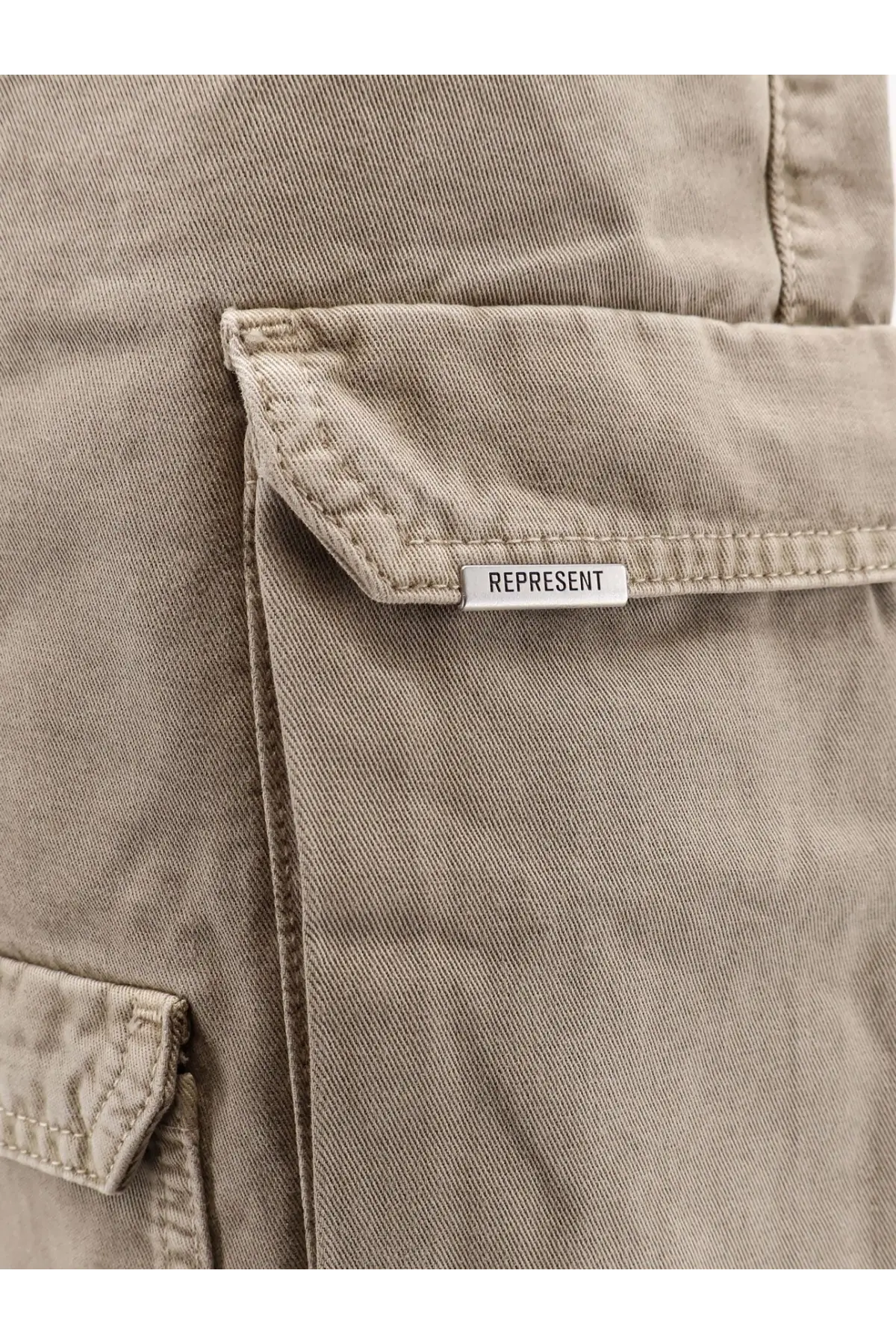 Beige represent men’s cotton cargo bermuda shorts with subtle textured fabric and white brand tag on pocket flap