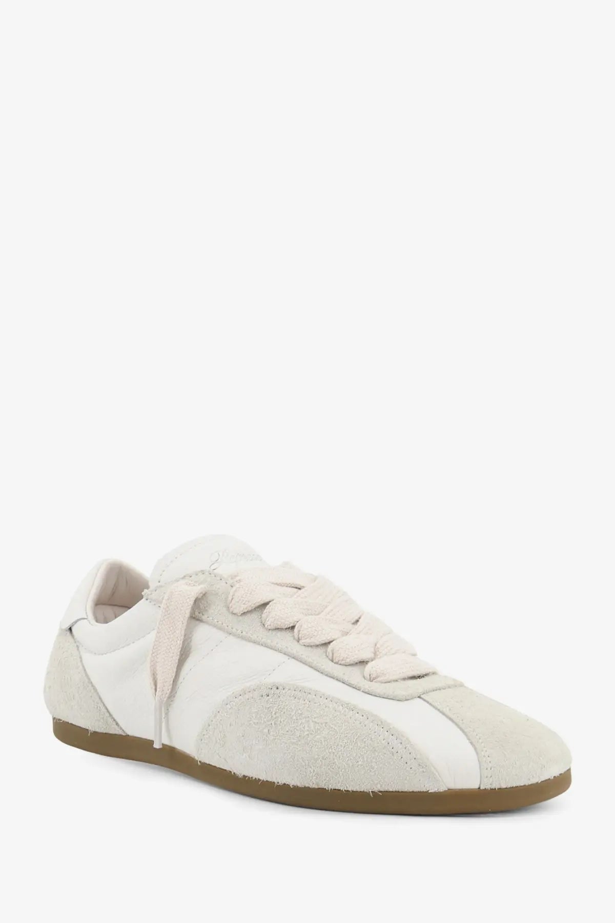 Cream-colored Represent men’s leather and suede low-top sneaker with canvas upper and tan rubber sole
