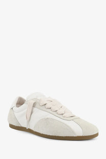 Cream-colored Represent men’s leather and suede low-top sneaker with canvas upper and tan rubber sole