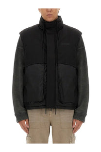 Represent men’s padded vest black with contrasting dark gray leather sleeves and subtle embroidered logo on chest