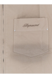 Beige denim jacket pocket with represent embroidered in silver thread and white snap buttons on represent men’s ramona cotton shirt green