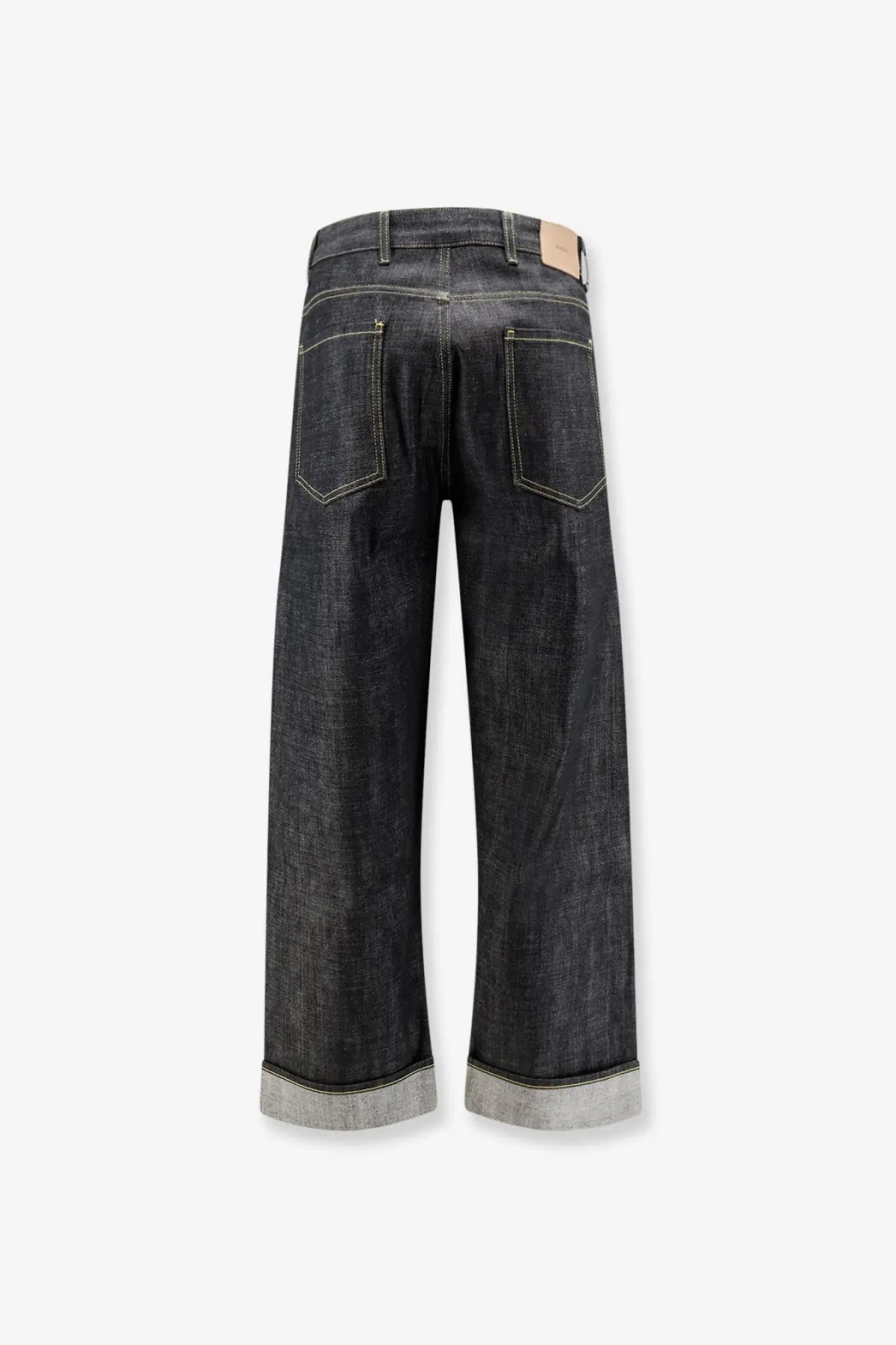 Dark-wash wide-leg denim jeans with rolled cuffs light stitching and beige leather brand tag represent men’s selvedge denim shirt black