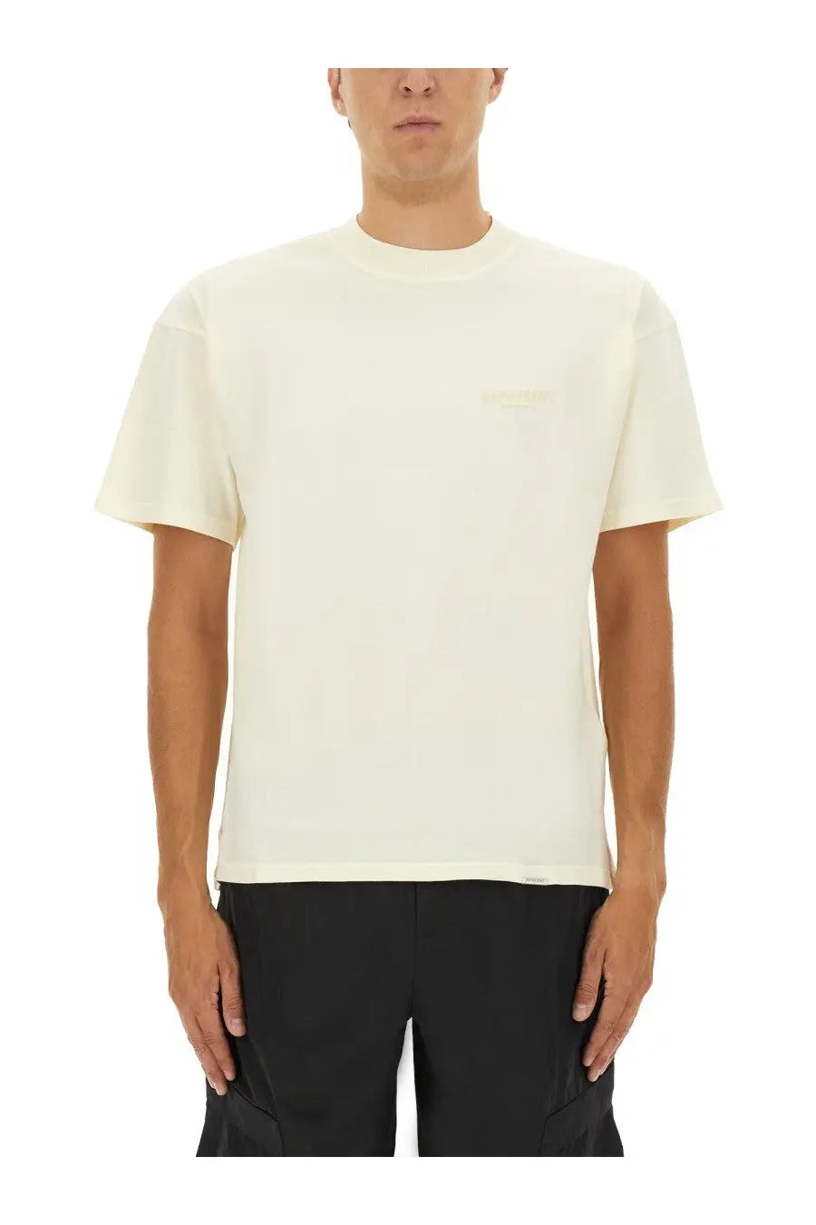 Represent men’s beige crewneck t-shirt in cream with minimalist design and subtle embroidered logo on the chest
