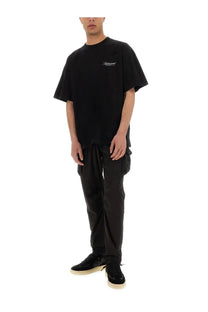 Black oversized cotton t shirt with subtle white embroidered logo on chest from represent owners club script collection