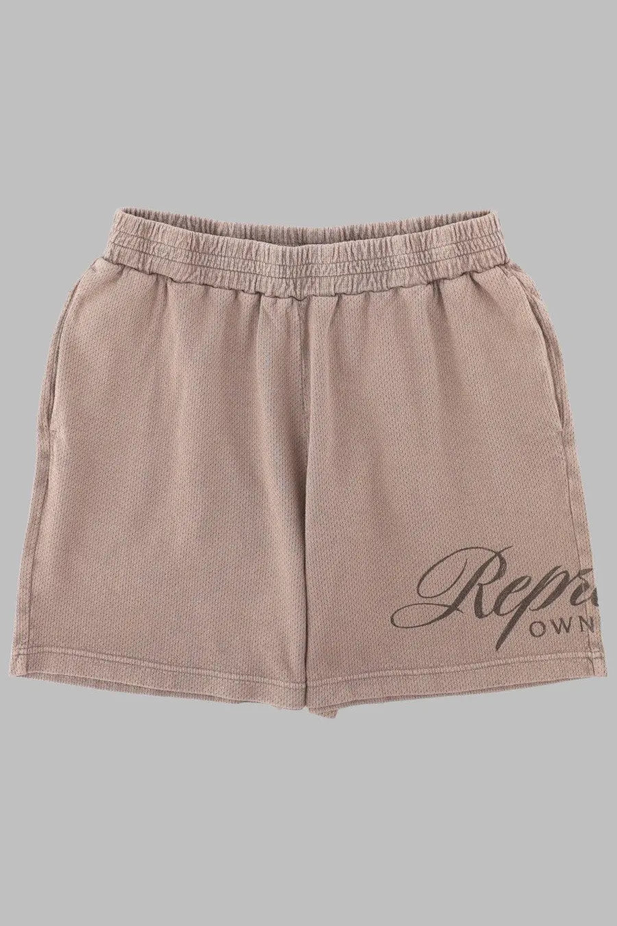 Beige represent men’s sweatshorts with elastic waistband and cursive repe logo printed on the left leg
