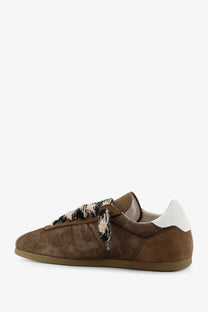 Brown suede represent men’s sneaker with white heel tab and patterned knit laces showing the back side