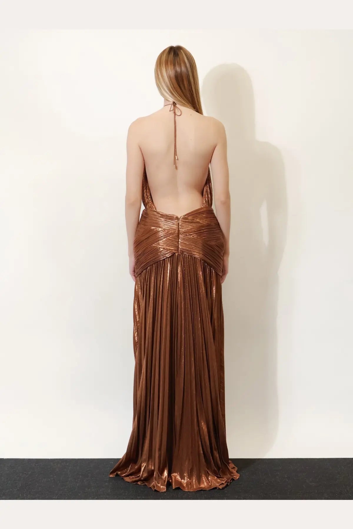 Retrofete women’s amberley pleated dress in shimmering bronze with backless design and tied halter straps visible from back