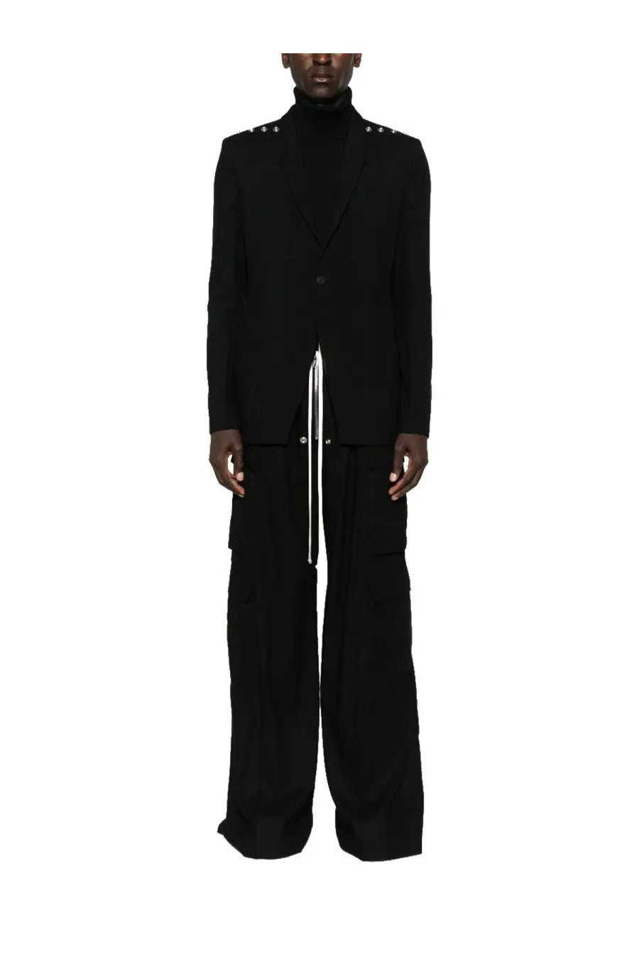 Black tailored blazer with silver studs on shoulders and central zipper detail paired with Rick Owens men’s cargo pants bela black